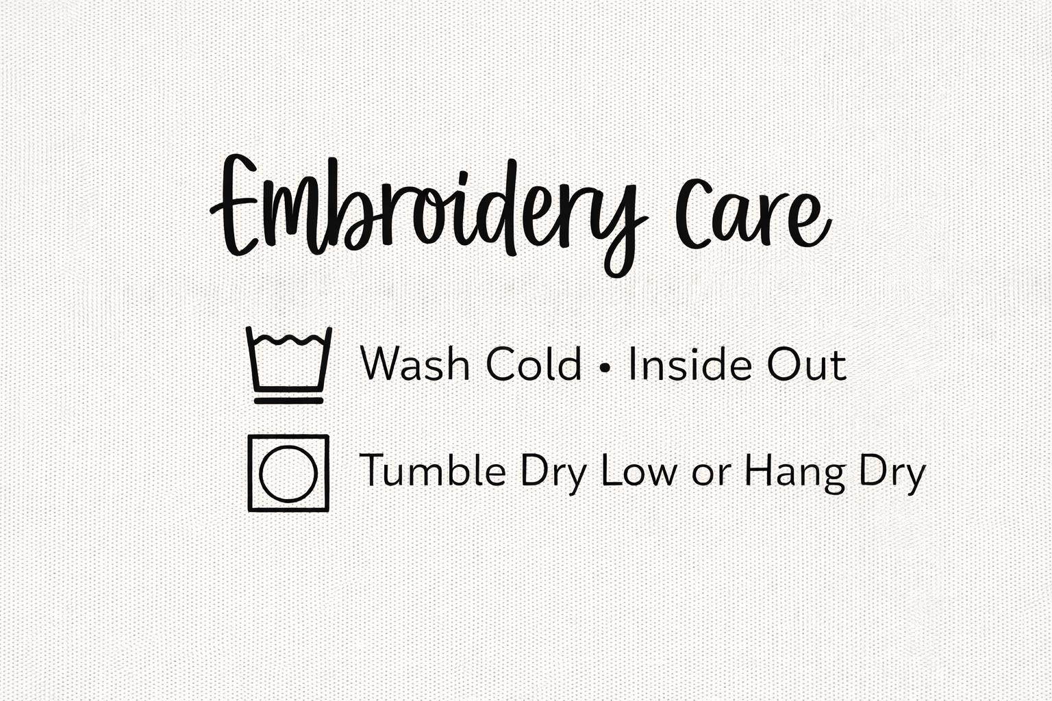 Care instructions for embroidered Comfort Colors teacher sweatshirt including machine wash cold