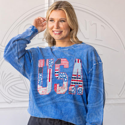 Lifestyle photo of blue USA applique sweatshirt styled as a patriotic outfit for Fourth of July and summer holidays.