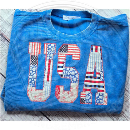 Blue oversized corded crewneck sweatshirt with large USA applique design for Fourth of July and Memorial Day outfits.
