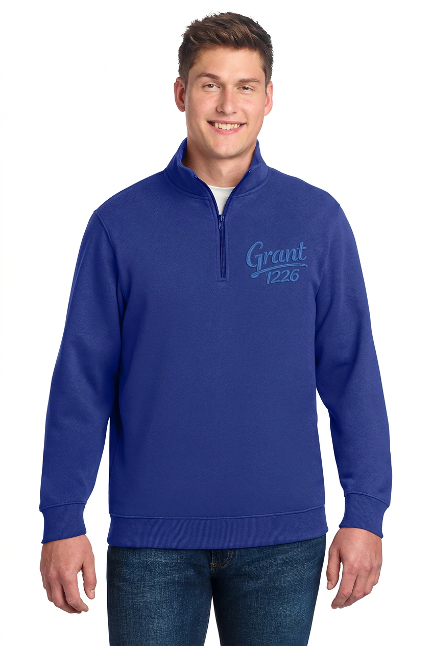 True Royal quarter-zip fleece pullover mockup with blue Grant 1226 left-chest embroidery