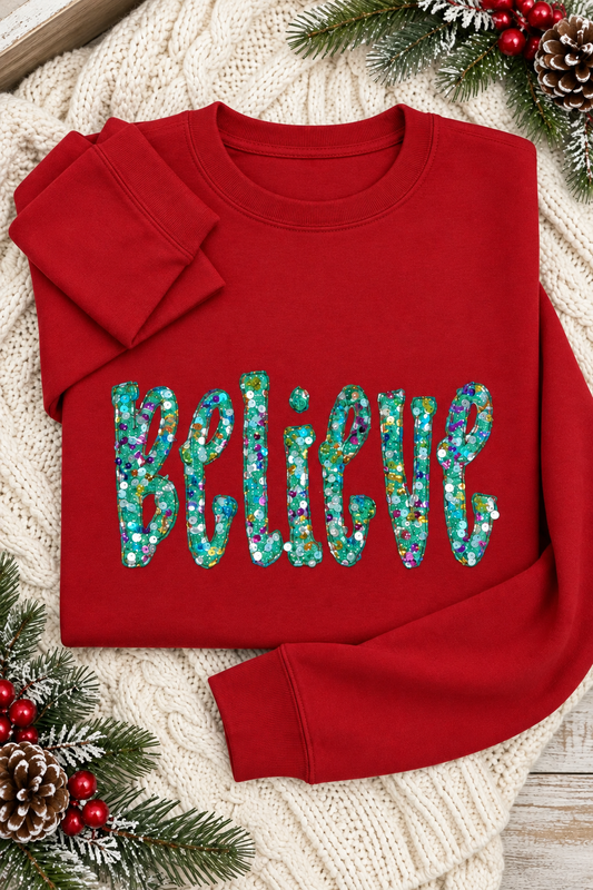 Mockup of red Believe sequin appliqué crewneck sweatshirt in a holiday flat lay