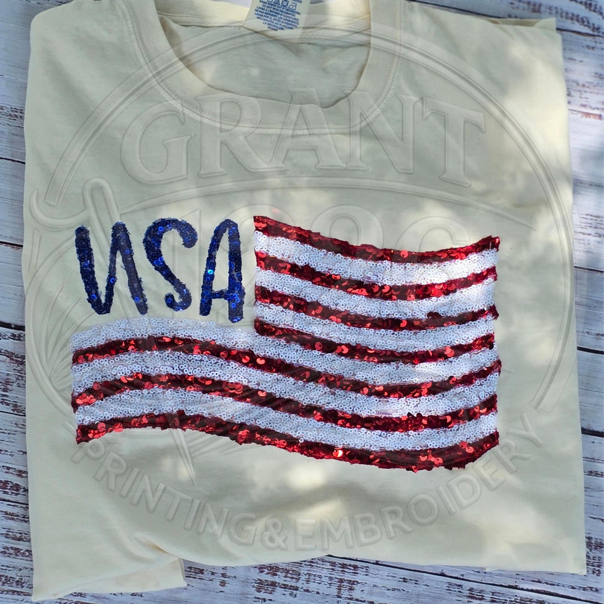 Ivory Comfort Colors patriotic USA shirt displayed in flat lay style.