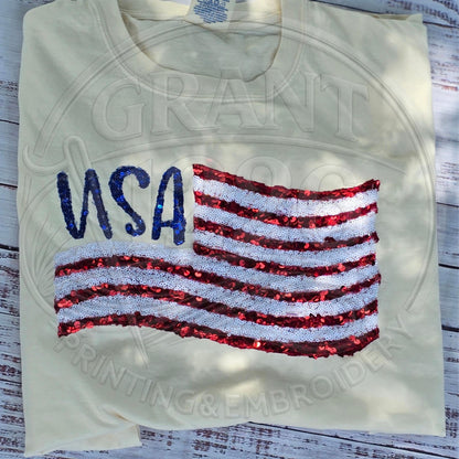 Ivory Comfort Colors patriotic USA shirt displayed in flat lay style.