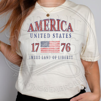 Woman modeling ivory America 1776 patriotic Comfort Colors graphic tee