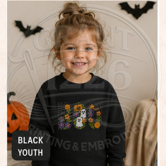 Black youth crewneck sweatshirt with embroidered floral BOO Halloween design featuring ghosts, pumpkins, and flowers