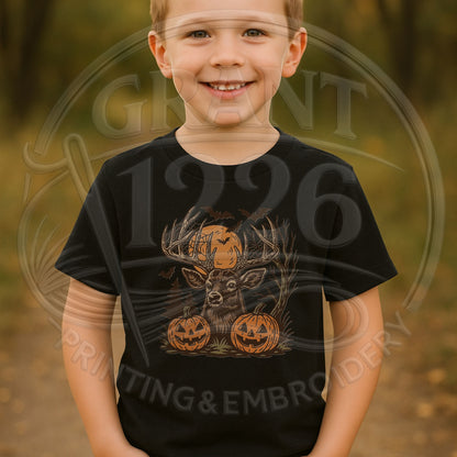 Child wearing black kids Halloween T-shirt with deer, antlers, bats, and jack-o-lanterns