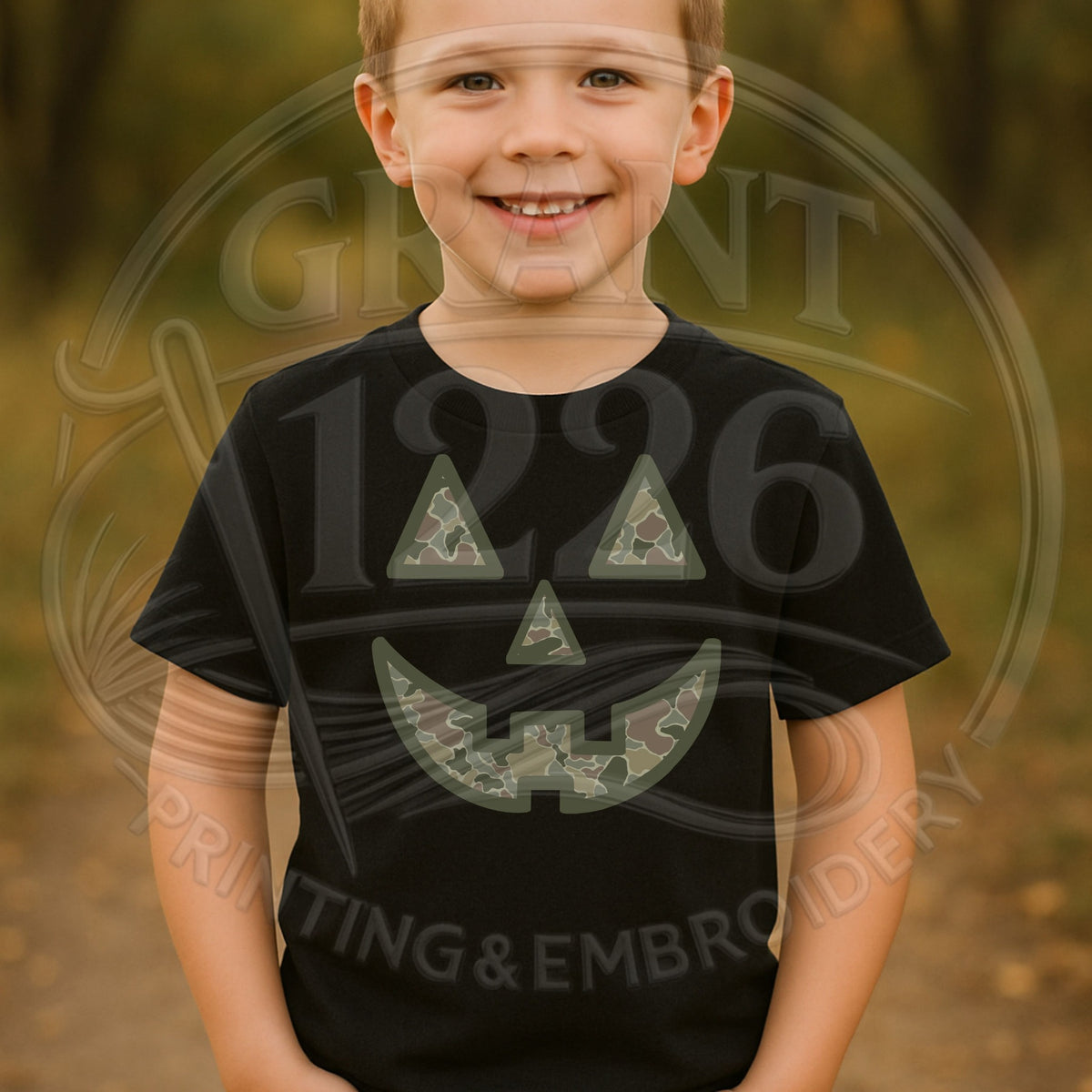 Child wearing Black camouflage jack-o-lantern Halloween shirt