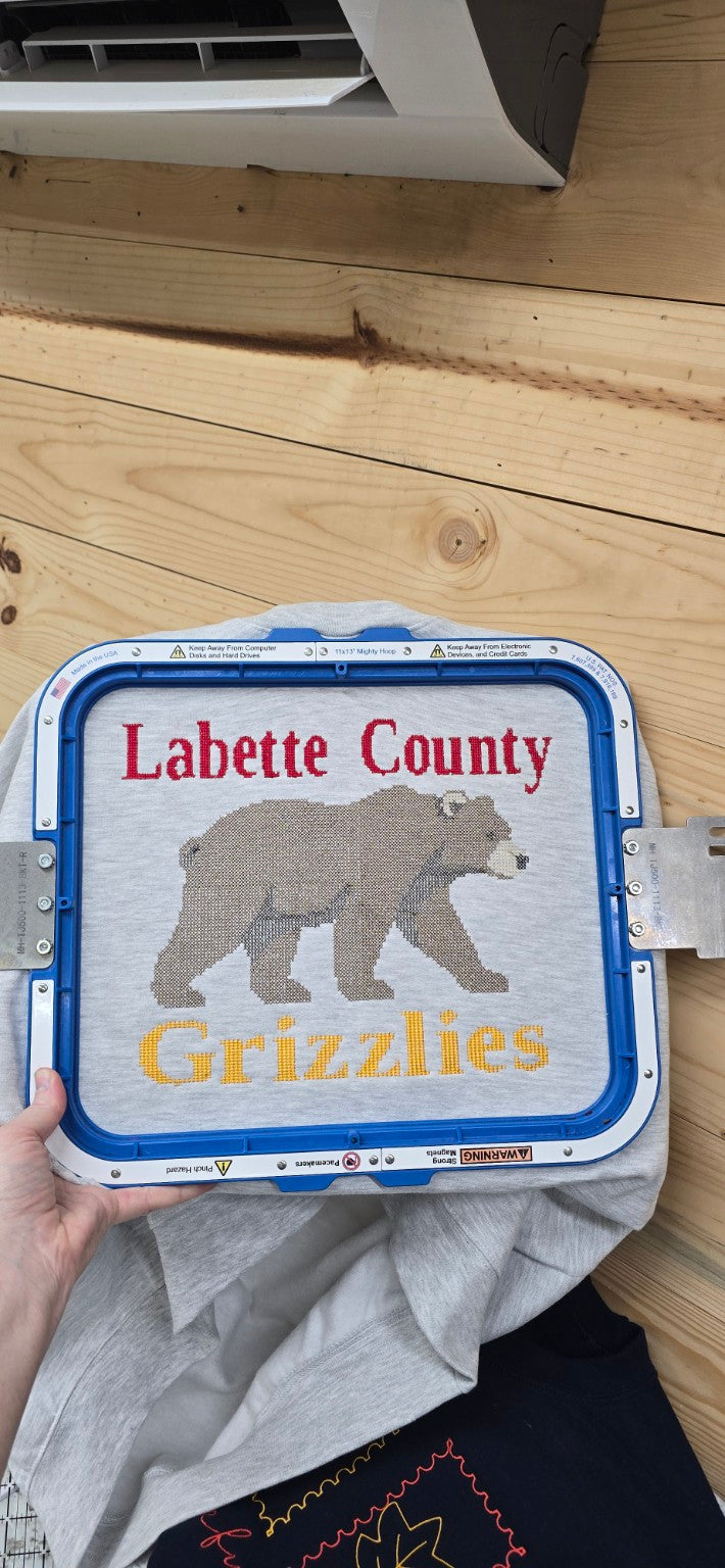 Labette County Grizzlies full-chest embroidered design on a grey Gildan sweatshirt