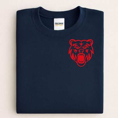 Navy left-chest bear mascot sweatshirt modeled while holding a white pumpkin
