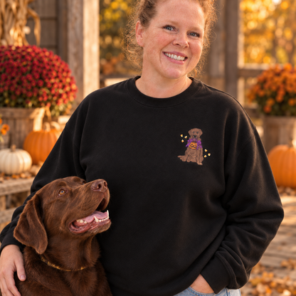 Close view of small left chest Halloween Labrador embroidery on a black crewneck sweatshirt