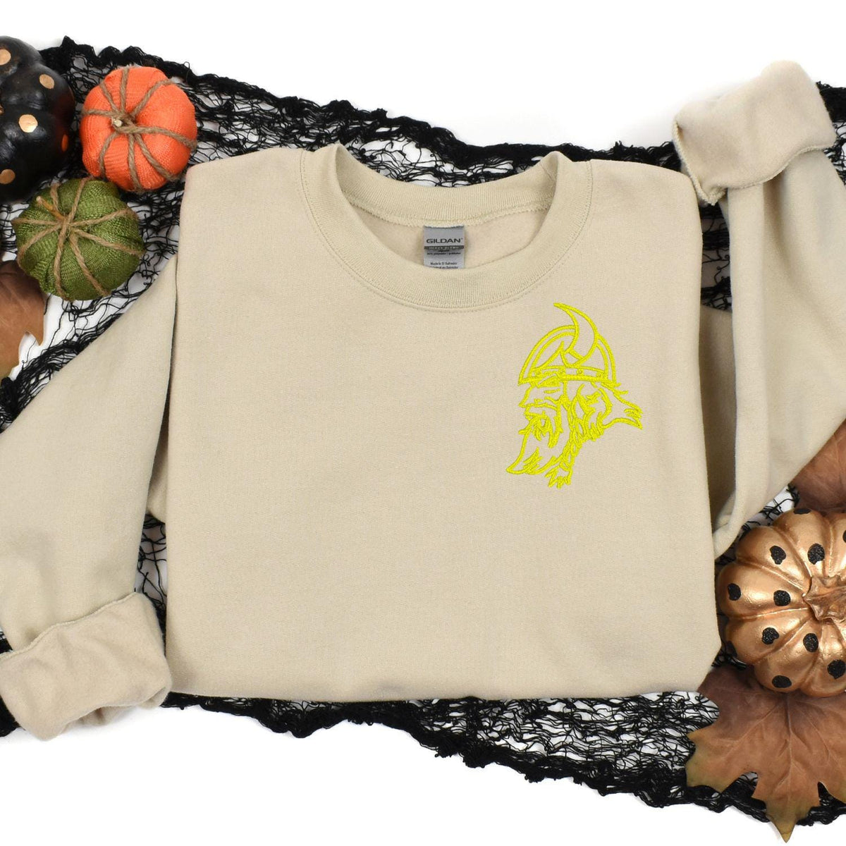 Sand left-chest Viking sweatshirt styled with fall pumpkins and black lace