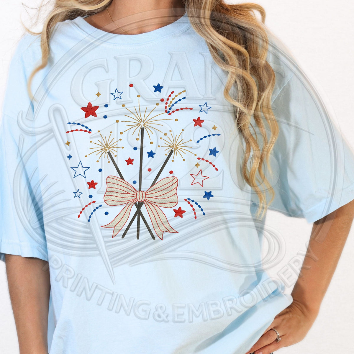 Light blue embroidered patriotic fireworks bow T-shirt close-up