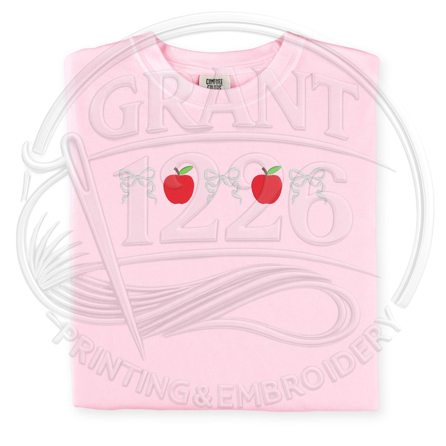Pink Comfort Colors embroidered teacher shirt with apple embroidery