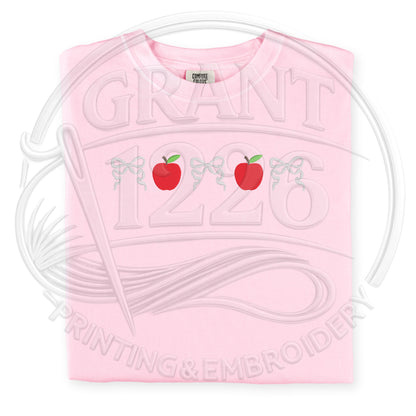 Pink Comfort Colors embroidered teacher shirt with apple embroidery