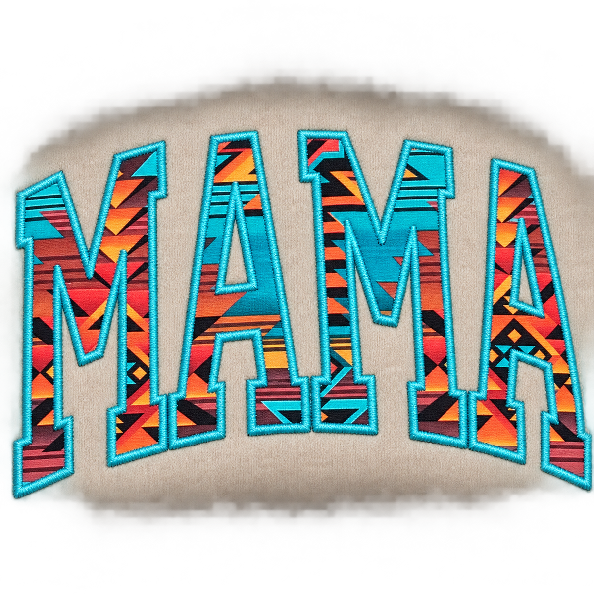 Close-up of turquoise rust and black MAMA Aztec appliqué and embroidery