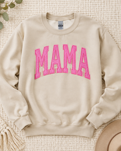 Sand Gildan Heavy Blend MAMA sweatshirt with hot pink glitter vinyl appliqué flat lay