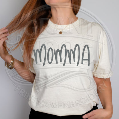 woman wearing ivory embroidered mama shirt with minimalist aesthetic