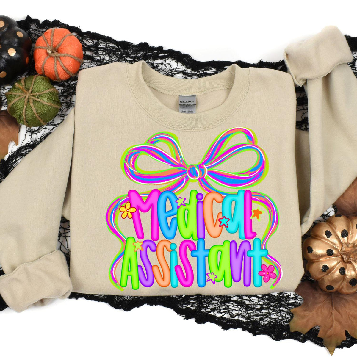 Sand Medical Assistant graphic sweatshirt styled with fall pumpkins
