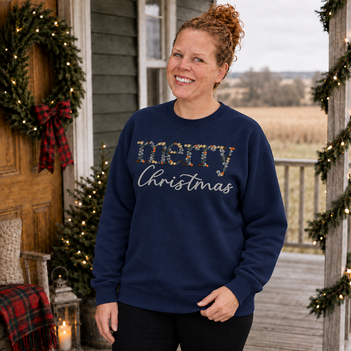 Navy Gildan Softstyle Merry Christmas floral embroidered sweatshirt on Samantha