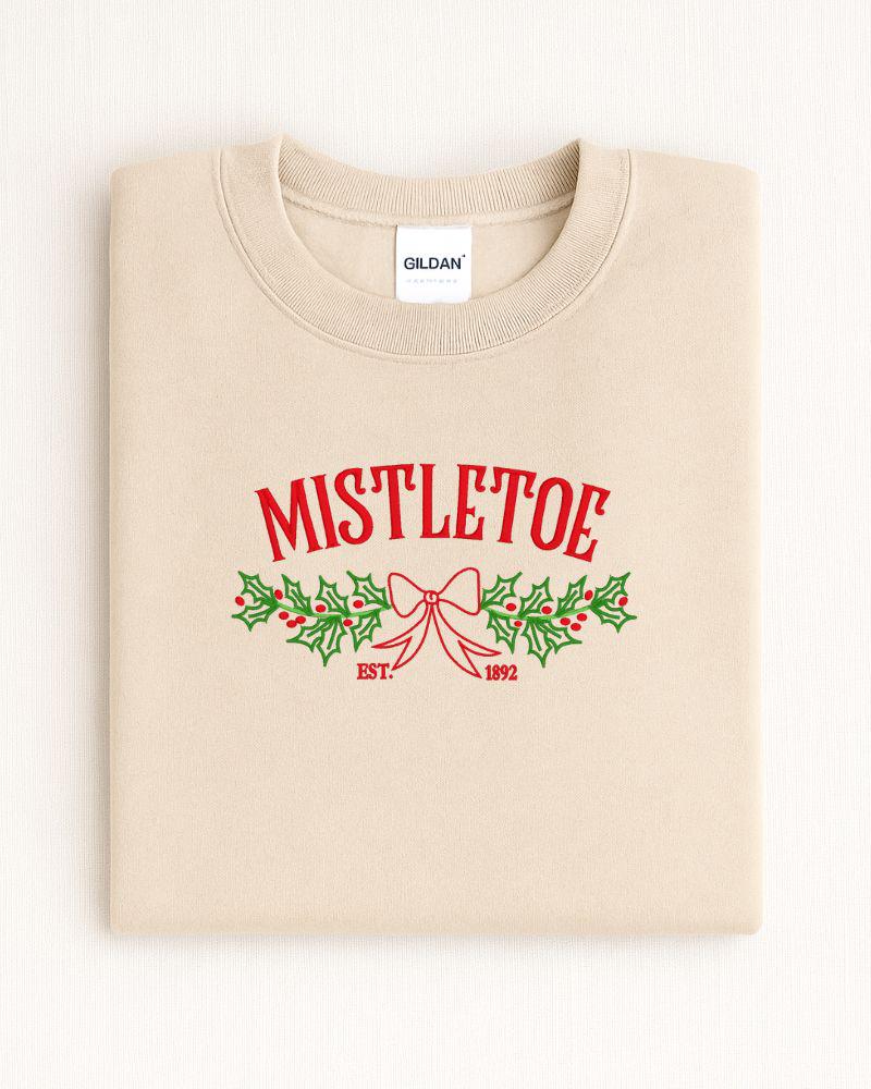 Gildan holiday crewneck featuring delicate machine embroidered mistletoe
