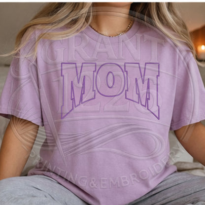 Woman wearing orchid Comfort Colors mom shirt with puff embroidery design