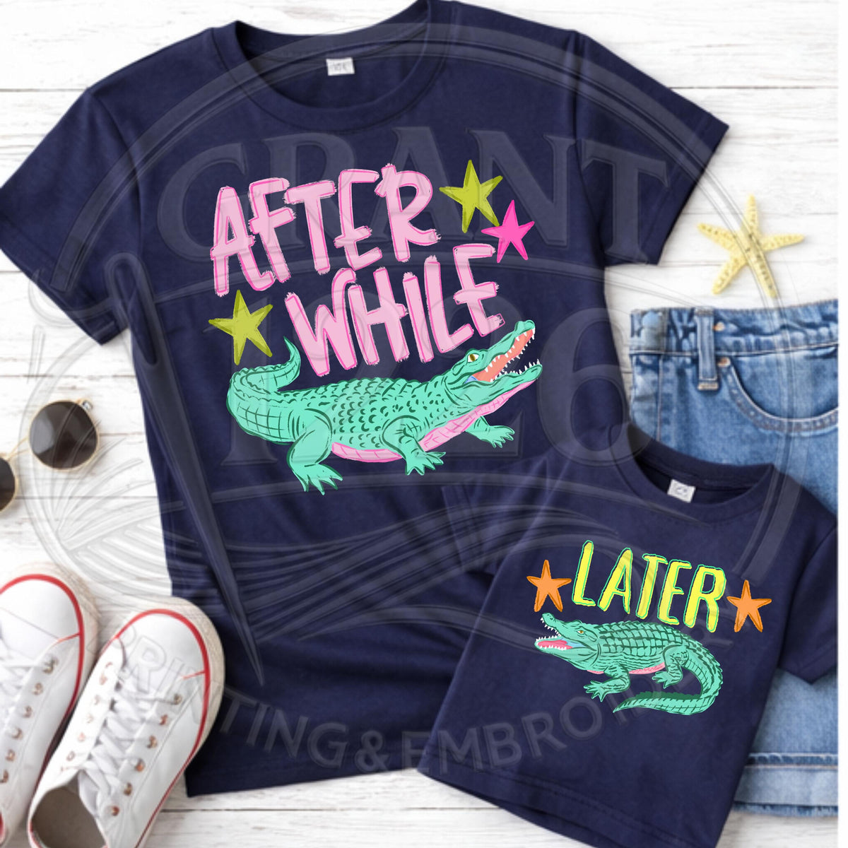 Navy mommy and me alligator matching shirt set in a flat lay