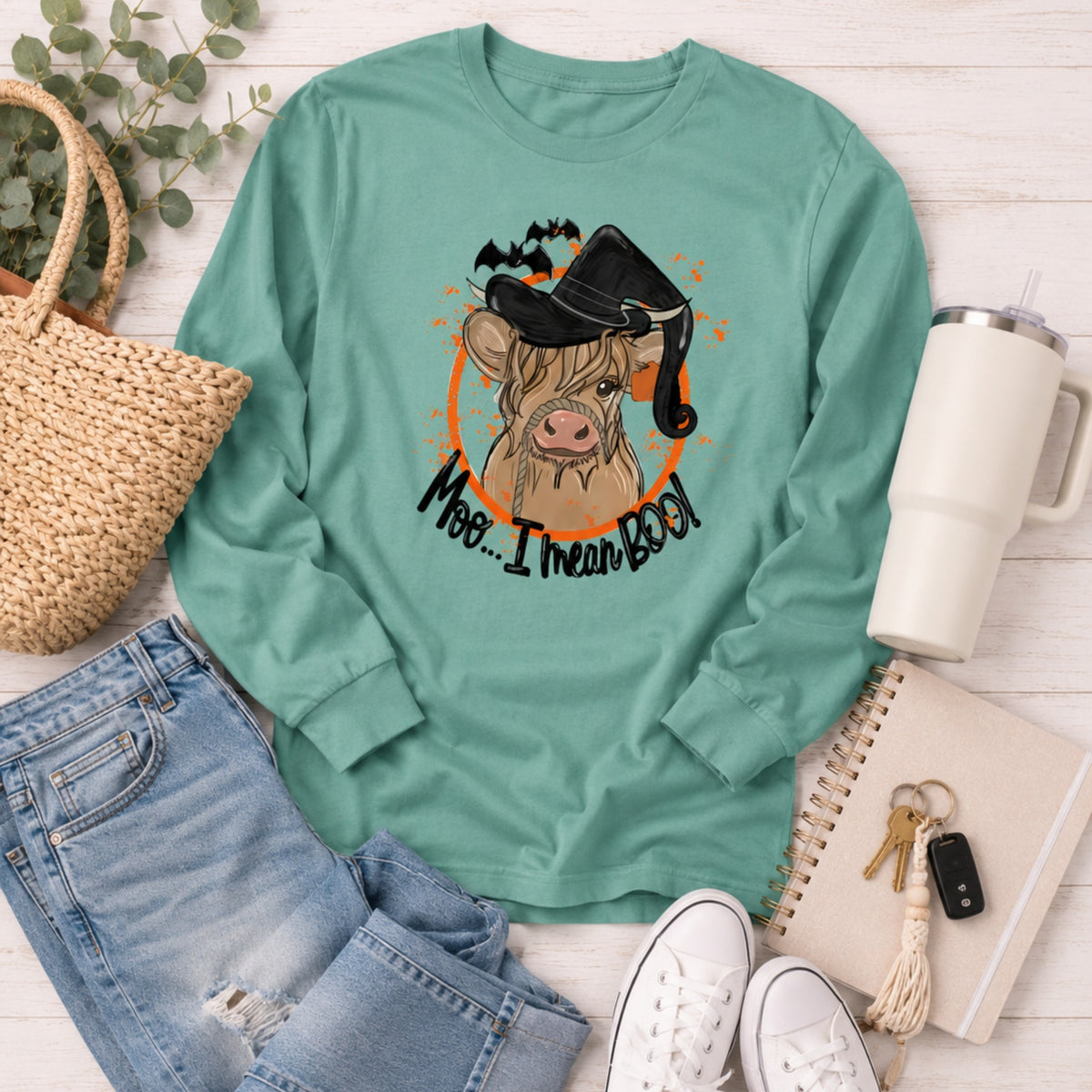 Seafoam Comfort Colors Highland cow witch Halloween long-sleeve shirt flat lay
