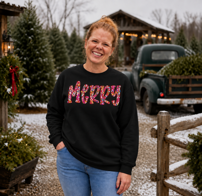 Multicolor sequin MERRY appliqué on a Black Gildan Softstyle sweatshirt