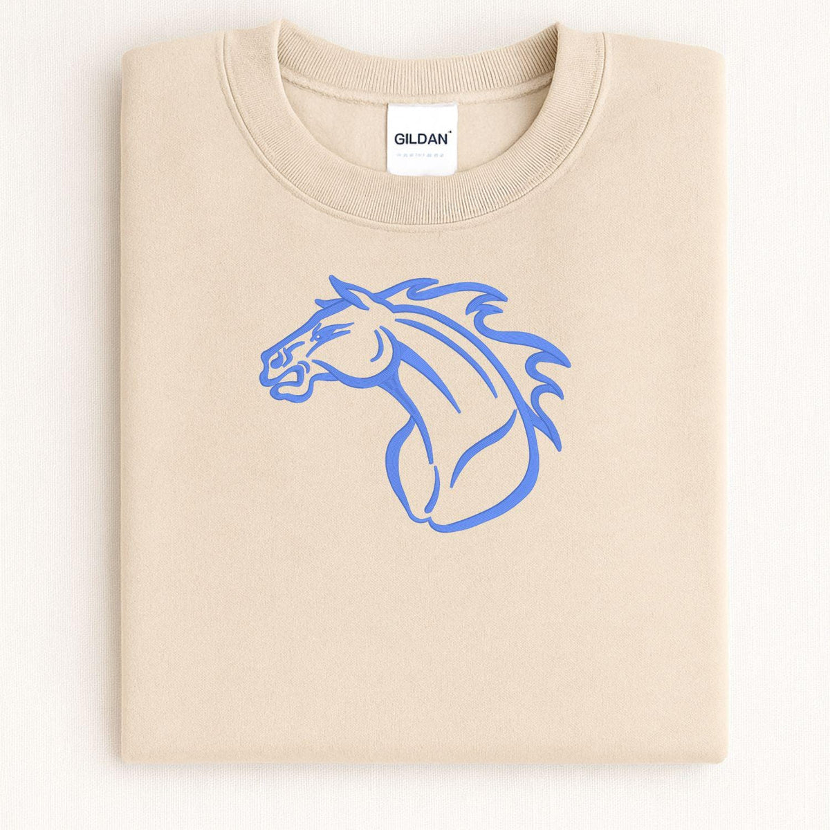 Sand Mustang mascot embroidered crewneck folded on a light background