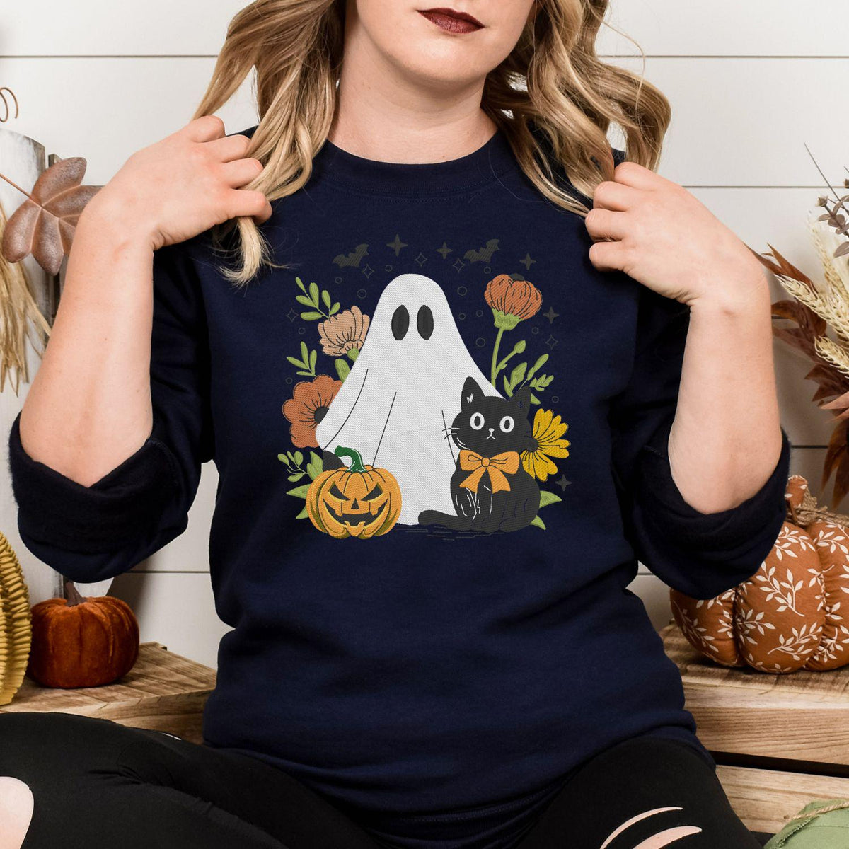 Navy embroidered sweatshirt with a white ghost, black cat and autumn flowers
