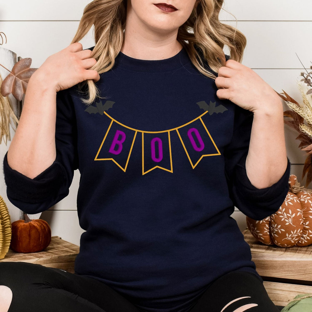 Navy embroidered BOO pennant banner sweatshirt lifestyle view