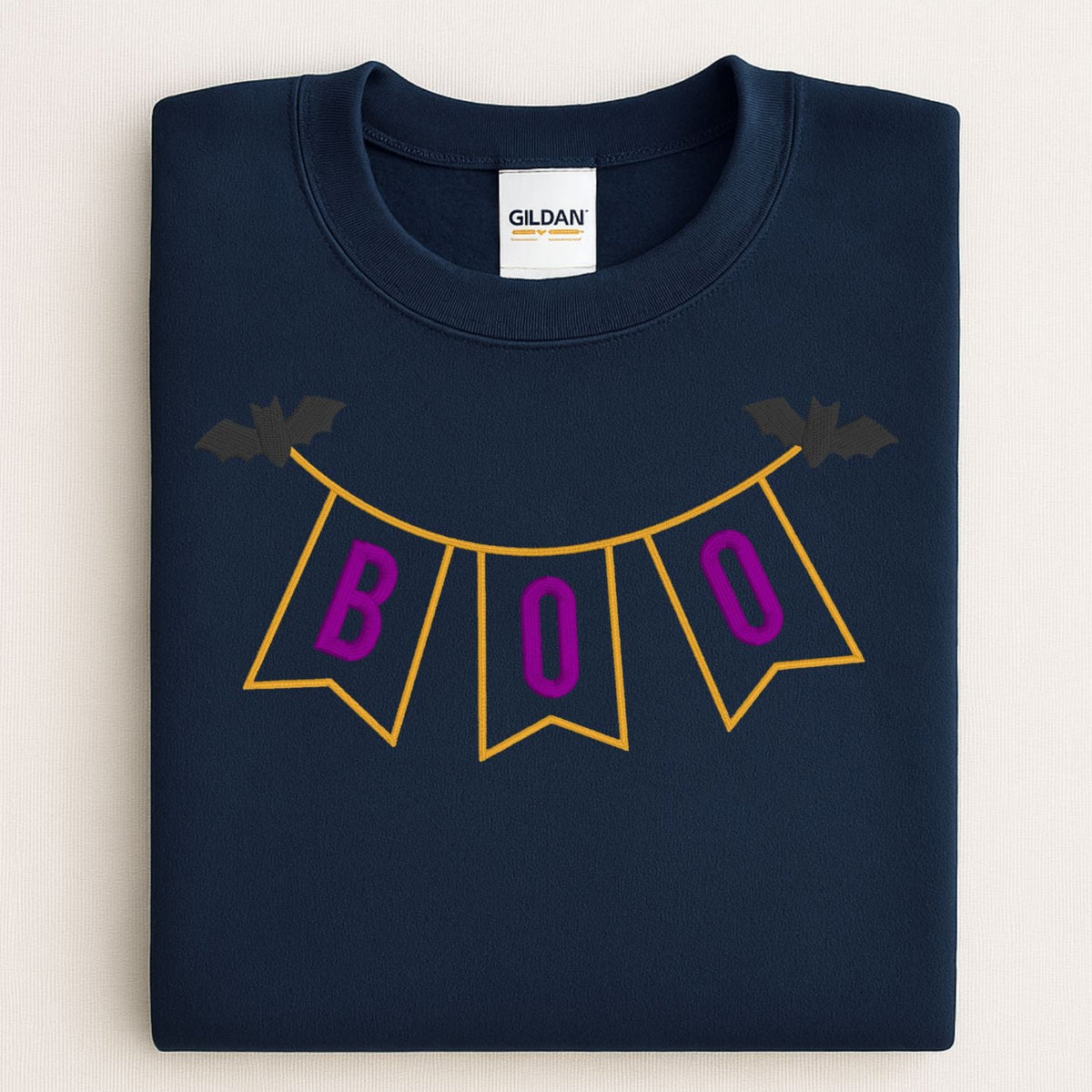 Navy BOO banner applique embroidered Halloween sweatshirt flat lay