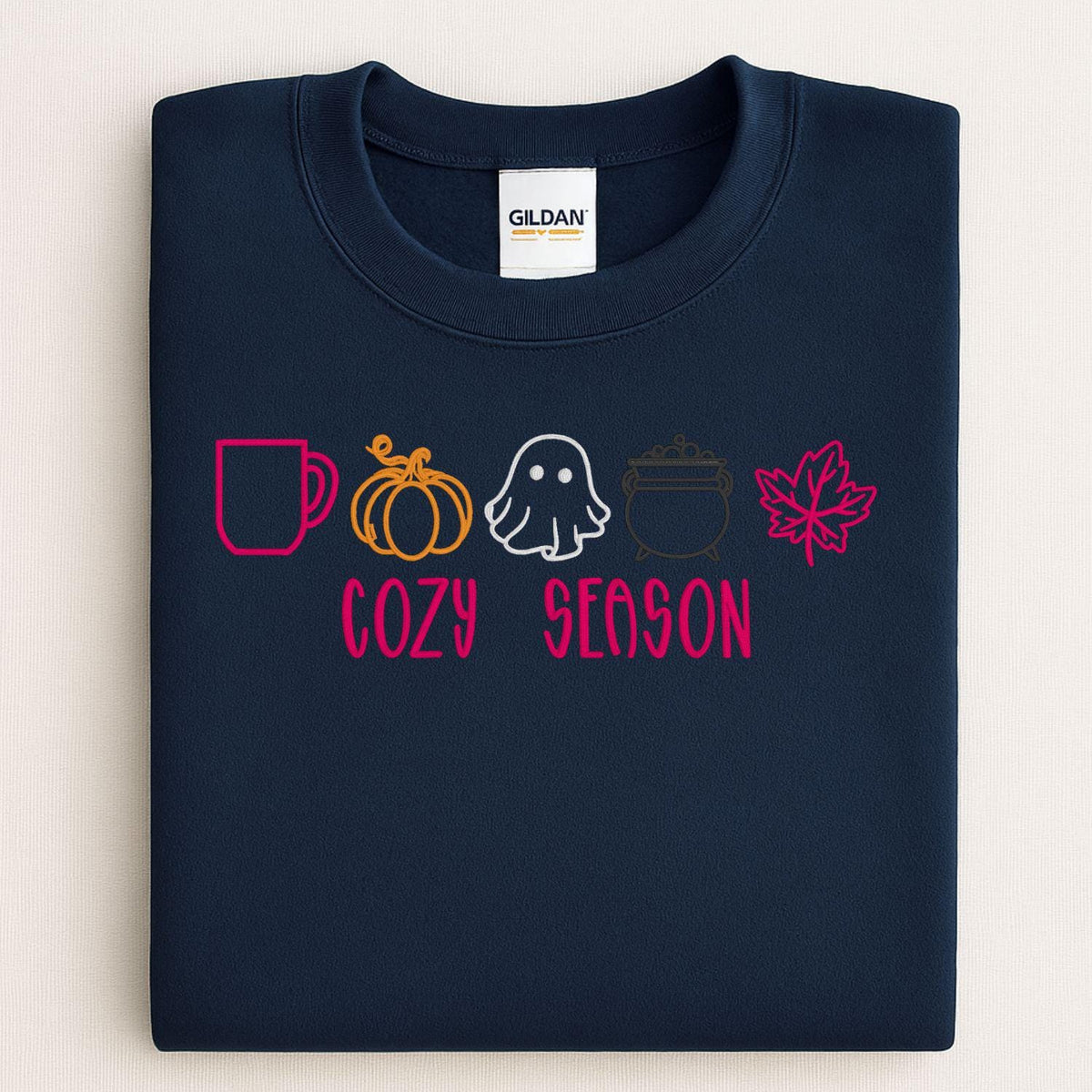 Navy Gildan sweatshirt embroidered with colorful Cozy Season fall icons
