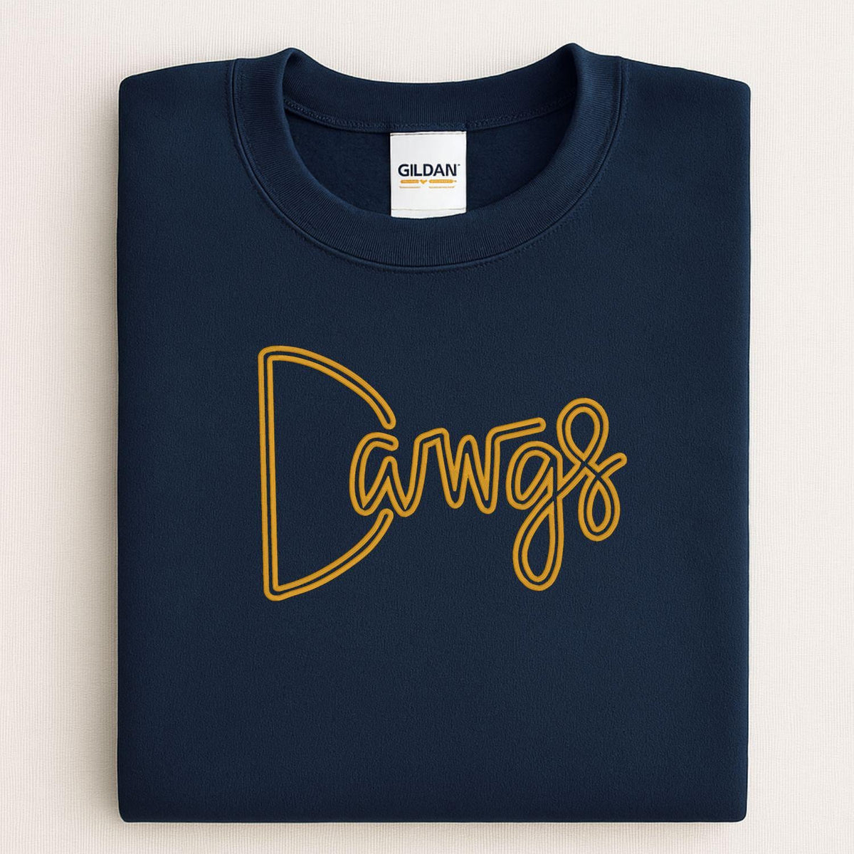 Navy Gildan sweatshirt with gold Dawgs puff embroidery across the chest