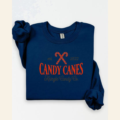Navy Kringle Candy Co candy cane holiday embroidered crewneck flat lay