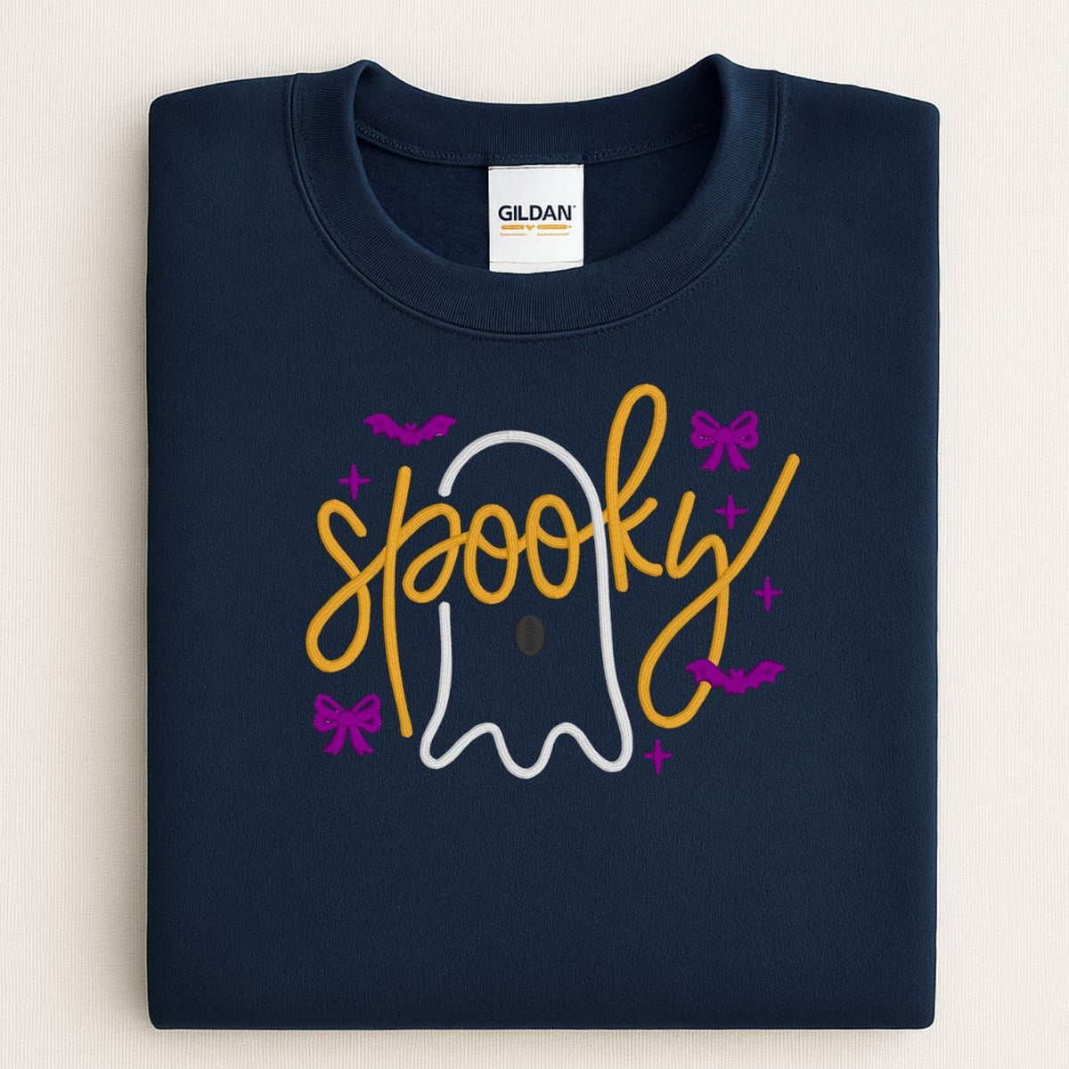 Folded Navy crewneck with Spooky ghost, bow and bat embroidery