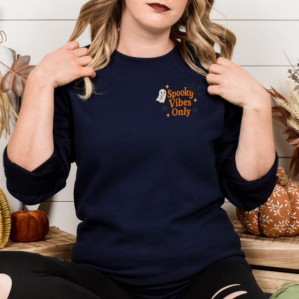 Navy ghost embroidered sweatshirt with Spooky Vibes Only left-chest design