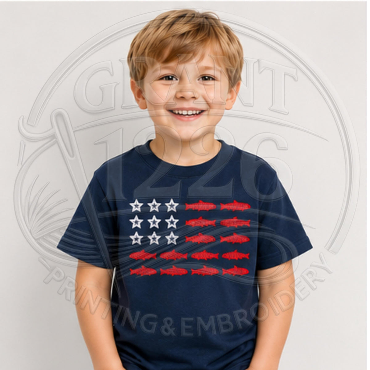 Navy youth patriotic fishing shirt with white stars and red fish embroidery.