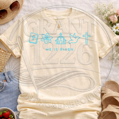 Ivory Comfort Colors He Is Risen Easter shirt featuring pastel Christian faith symbols and religious artwork
