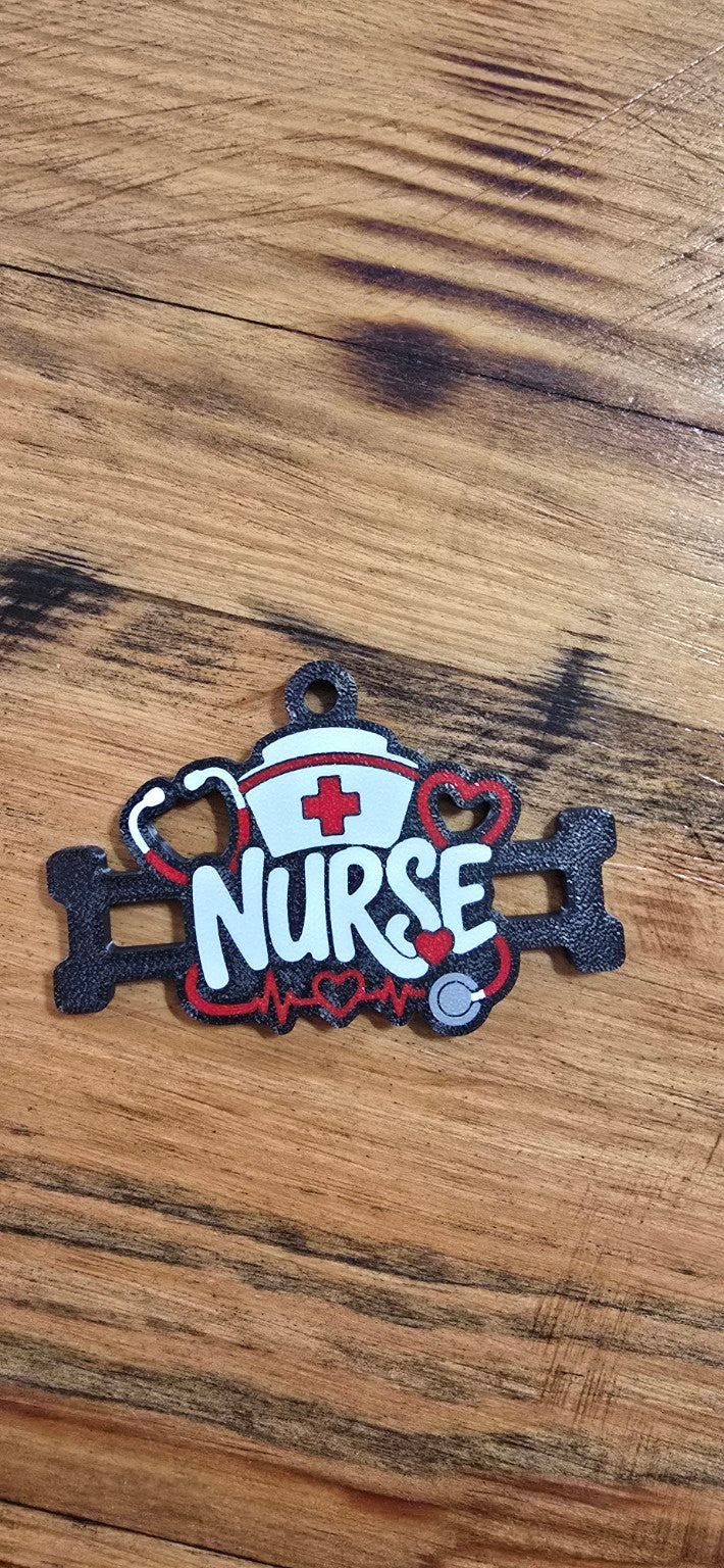 Red, white, and black nurse hair tie holder with cap, stethoscope, and heartbeat details