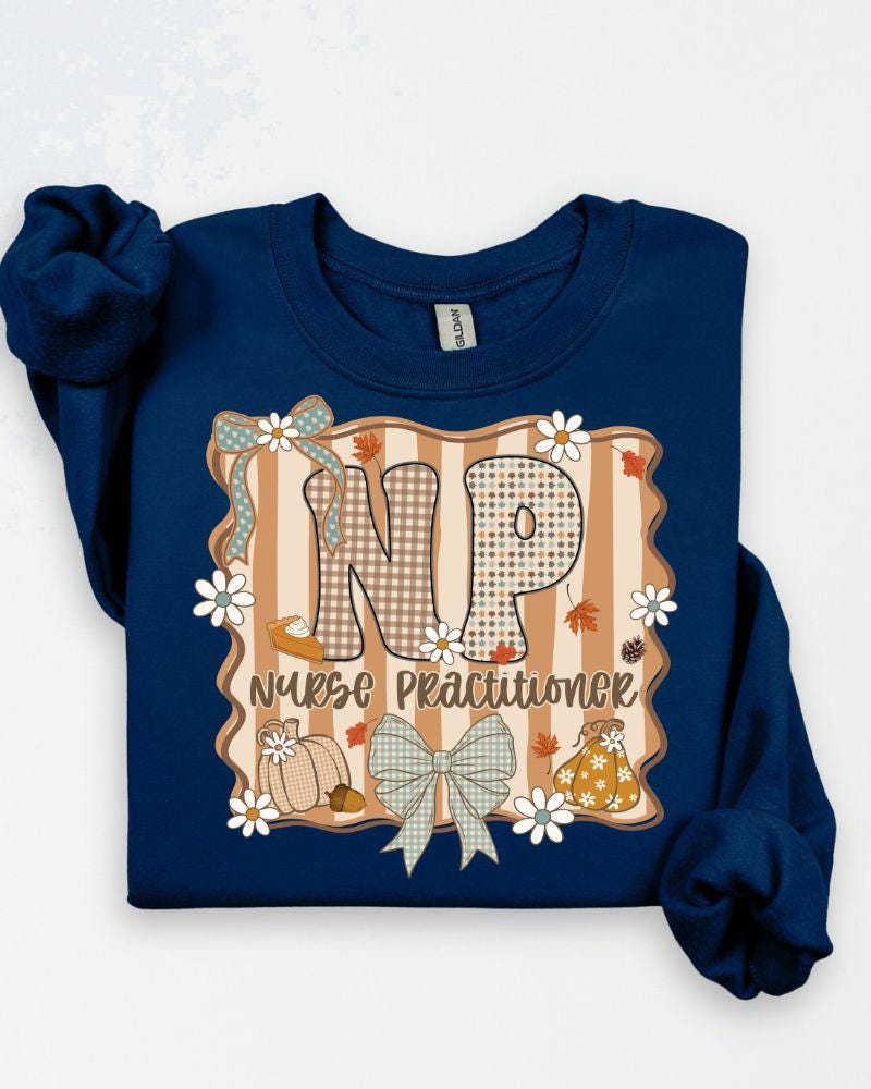 Ash Gildan Heavy Blend sweatshirt with fall NP Nurse Practitioner pumpkin and bow graphic