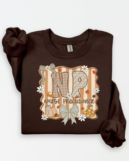 Sand Gildan Heavy Blend sweatshirt with fall NP Nurse Practitioner pumpkin and bow graphic