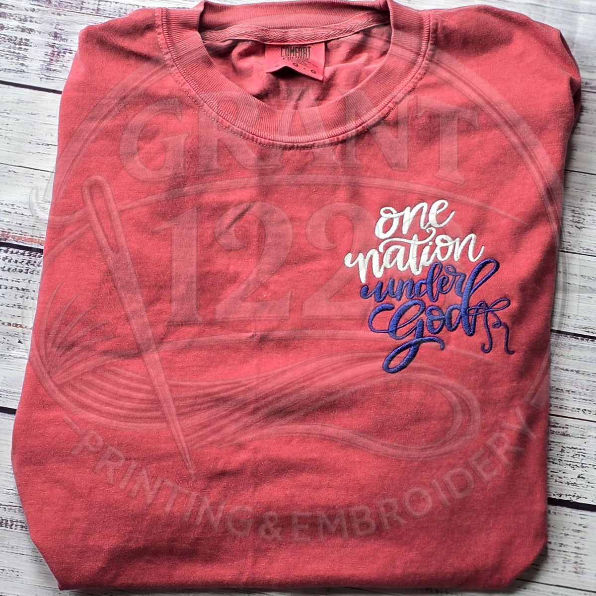 Brick Comfort Colors shirt with One Nation Under God left-chest embroidery