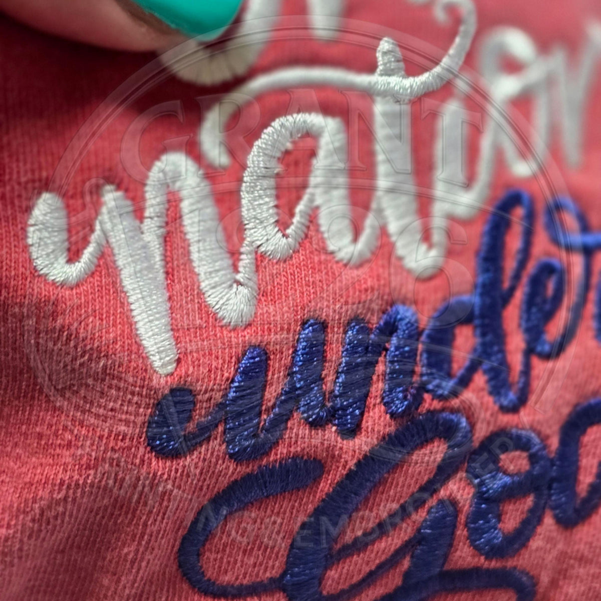 Close-up of red, white and blue One Nation Under God embroidery