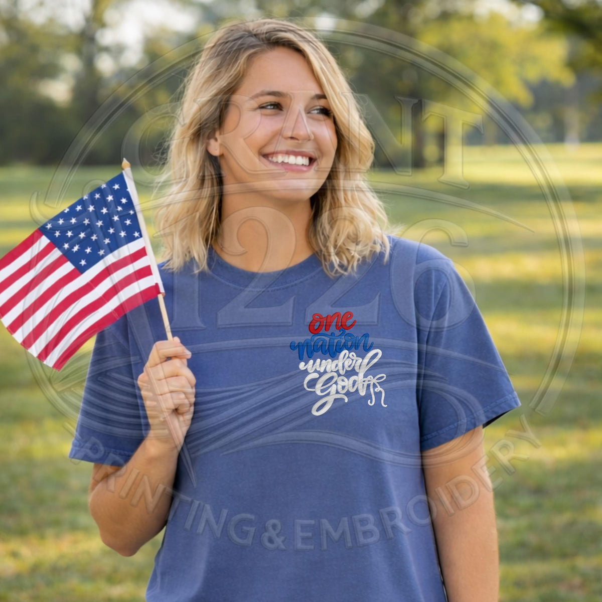Woman wearing One Nation Under God embroidered shirt outdoors