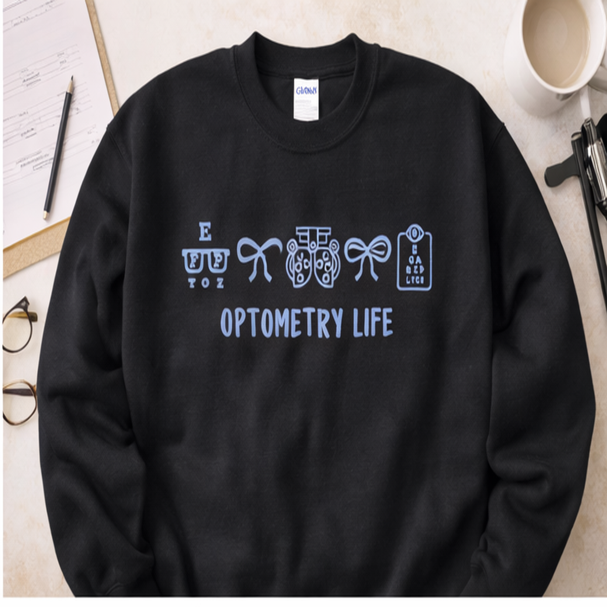 Black Gildan sweatshirt with light blue Optometry Life embroidery for eye-care professionals