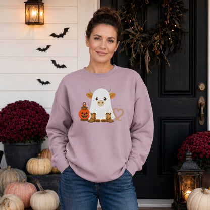 Woman wearing a Paragon Gildan Softstyle embroidered ghost Highland cow Halloween sweatshirt