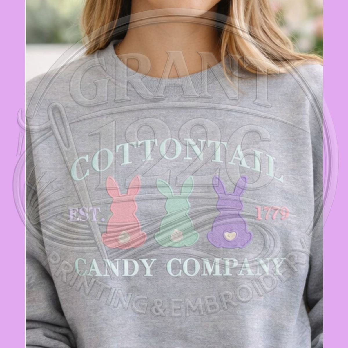 Close-up of pastel bunny embroidery on an ash sweatshirt