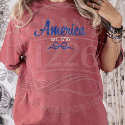 Woman wearing red vintage America embroidered patriotic shirt