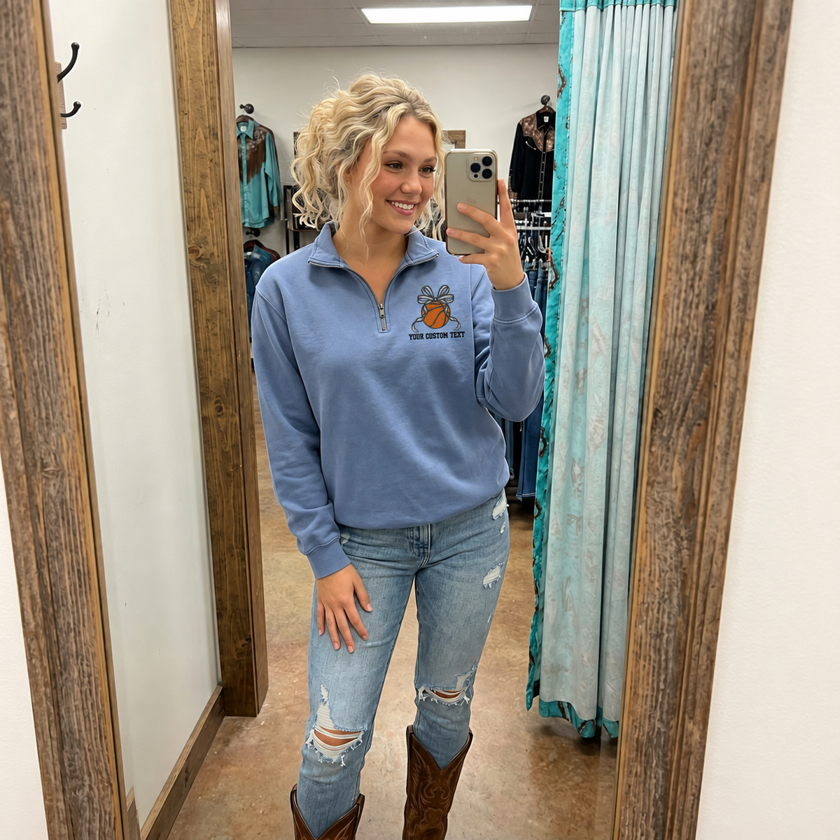 Woman wearing a Blue Jean Comfort Colors quarter zip with personalized basketball bow left chest embroidery
